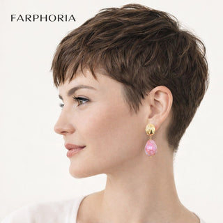 Woman with short brown hair wearing pink earrings on a white background, with 'FARPHORIA' branding.