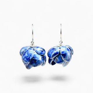 Blue marbled peony porcelain earrings with gold hooks on a light beige background