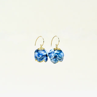 Blue marbled peony porcelain earrings with gold hooks on a light beige background