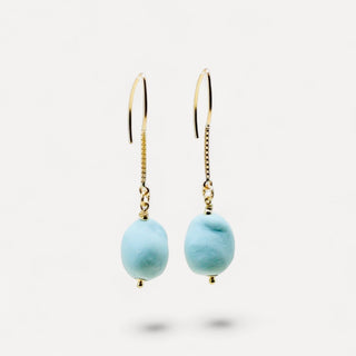 Hand-shaped turquoise porcelain earrings with a velvety matte finish, a thoughtful gift for a partner who loves unusual jewellery.