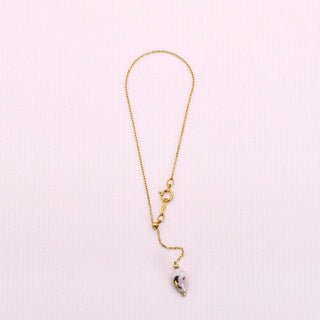 Elegant minimalist gold bracelet with adjustable sliding bead on a chain