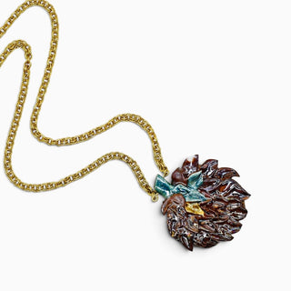 Unique porcelain jewellery gift for a woman featuring a double-sided artichoke pendant on a vintage gold chain