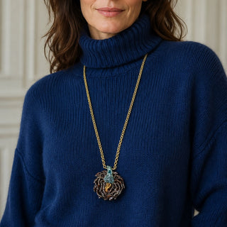 Porcelain artichoke statement necklace on a woman wearing a blue roll-neck jumper, a unique handmade gift for her