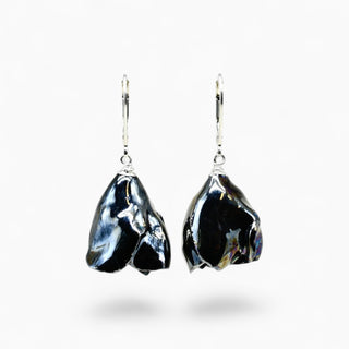 A pair of dangling earrings featuring glazed black flowers with silver leverbacks in a beautiful gift packaging