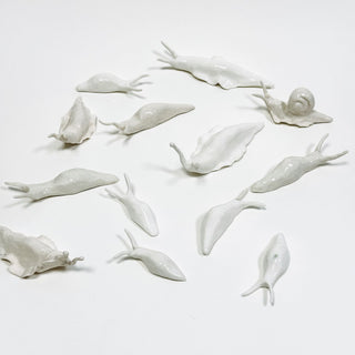 Playful white porcelain slug – humorous yet sophisticated handcrafted collectible, perfect for thoughtful and unusual gifts