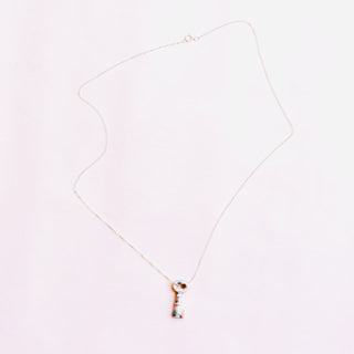 Necklace with a small key pendant handmade by FARPHORIA in London