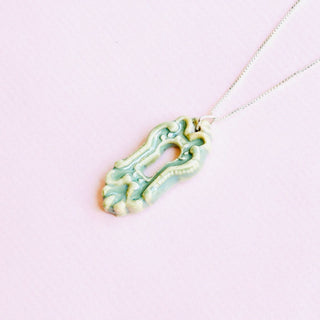 Necklace with a green porcelain pendant ships with a gift packaging