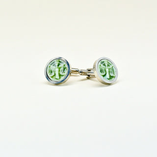 Cufflinks with green porcelain gemstones on a white background FARPHORIA 