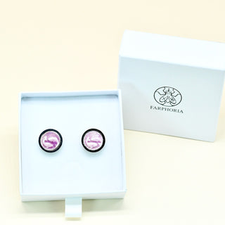 Round Pisces zodiac porcelain cufflinks in light purple set in stainless steel cufflink base in a white box with 'FARPHORIA' branding on a beige background