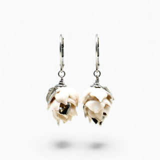 A pair of silver leverback earrings featuring sculpted, layered cream-colored artichoke flower charms -great gift for romantic occasion.