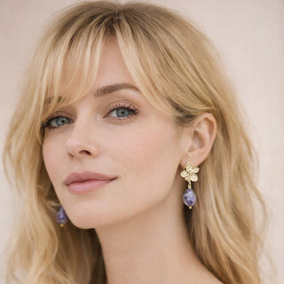 Handmade violet porcelain pearl earrings with gold flower stud worn by blonde model – luxury gift for her
