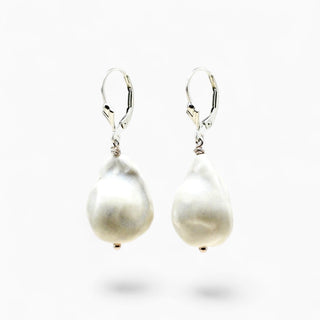 A pair of lightweight white porcelain pearl earrings, handmade in London as an 18th anniversary gift
