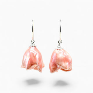 A pair of dangling earrings featuring natural pink dahlia flowers suspended from silver fishhook wires -beautiful gift for partner