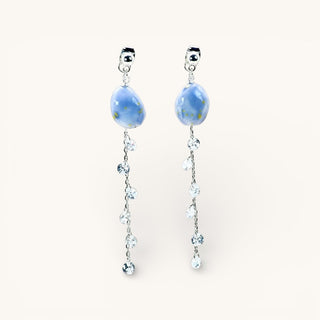 Sparkling blue porcelain earrings on a blonde model, an elegant birthday or anniversary gift for her