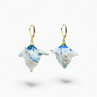 A pair of dangling handmade porcelain earrings crafted from real thistle flowers by FARPHORIA