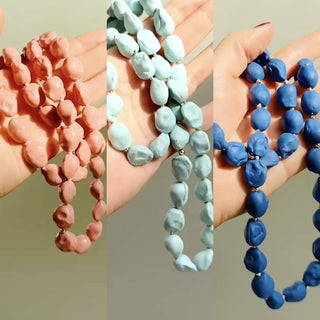 Handmade porcelain necklaces with golden accents, a meaningful porcelain anniversary gift.