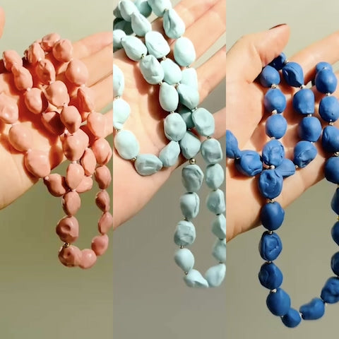 Handmade porcelain necklaces with golden accents, a meaningful porcelain anniversary gift.